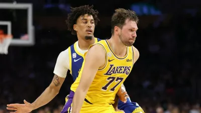 LOS ANGELES, CALIFORNIA - OCTOBER 21: Luka Doncic #77 of the Los Angeles Lakers dribbles past the defense of Yaxel Lendeborg #1 of the Golden State Warriors during the first half of a game at Crypto.com Arena on October 21, 2026 in Los Angeles, California.,Image: 1145561999, License: Rights-managed, Restrictions: NOTE TO USER: User expressly acknowledges and agrees that, by downloading and or using this photograph, User is consenting to the terms and conditions of the Getty Images License Agreement., Model Release: no 