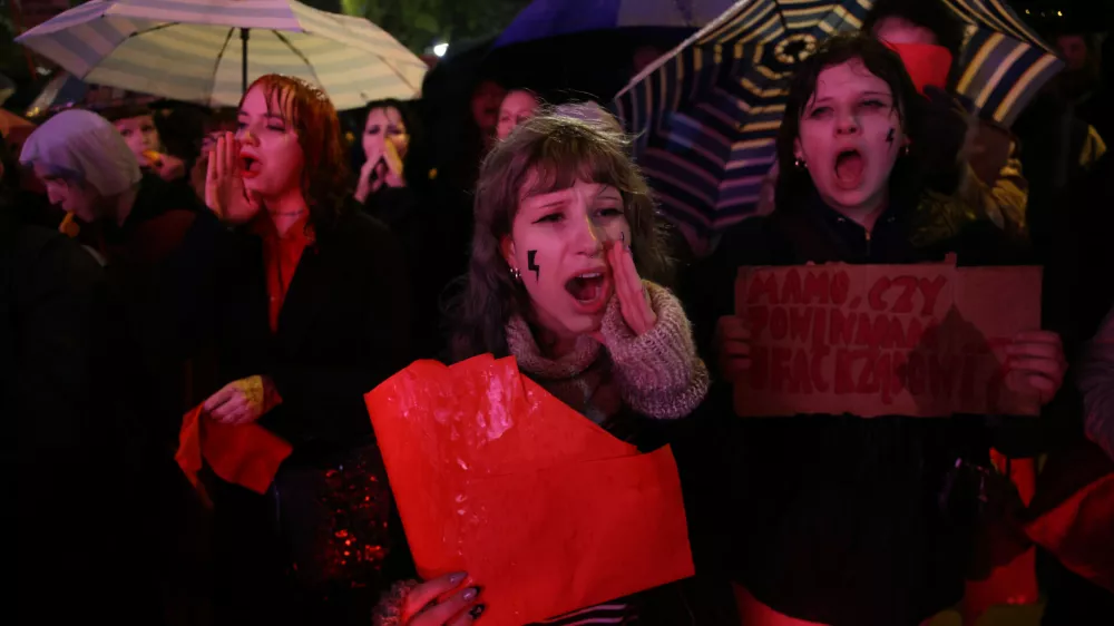 Protesters shout slogans during a demonstration against Poland's abortion law and demanding the legalization of abortion in Warsaw, Poland, Thursday, Oct. 22, 2026. (AP Photo/Beata Zawrzel)