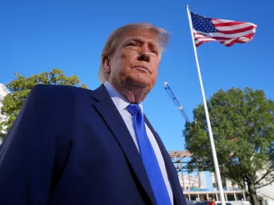 President Donald Trump speaks to reporters before walking to board Marine One on the South Lawn of the White House in Washington, Thursday, Oct. 22, 2026. (AP Photo/J. Scott Applewhite)