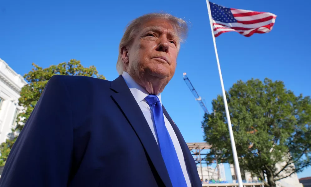 President Donald Trump speaks to reporters before walking to board Marine One on the South Lawn of the White House in Washington, Thursday, Oct. 22, 2026. (AP Photo/J. Scott Applewhite)