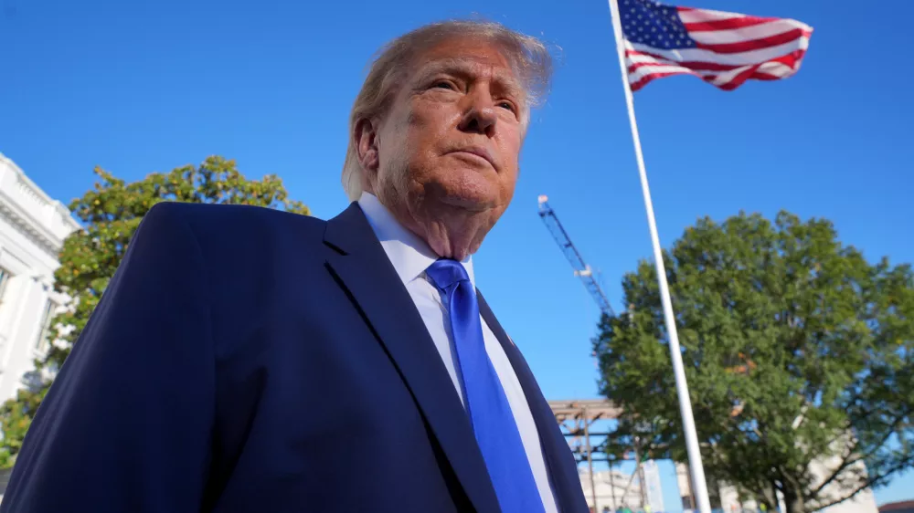 President Donald Trump speaks to reporters before walking to board Marine One on the South Lawn of the White House in Washington, Thursday, Oct. 22, 2026. (AP Photo/J. Scott Applewhite)