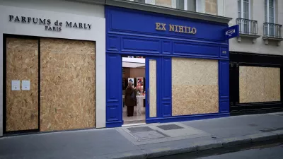 FILE PHOTO: View of shops with display windows protected by wooden panels days after nationwide protests against the cost of living and rising fuel prices in Paris, France, October 21, 2026. REUTERS/Stephane Mahe/File Photo