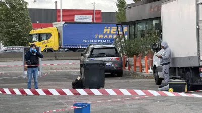 French police work at the scene after a drive-by shooting that killed one person and injured several others in Trappes, in the Yvelines department, near Paris, France, October 23, 2026. REUTERS/Antony Paone