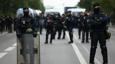 Officers of the French CRS riot police stand guard during a protest organised by student collectives and trade unions in Paris, France, October 22, 2026. REUTERS/Abdul Saboor