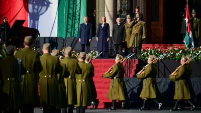 From left, Hungarian Prime Minister Peter Magyar, Agnes Forsthoffer, the Speaker of the National Assembly of Hungary and Hungary's President Andras Baka attend a flag-raising ceremony marking the 70th anniversary of the 1956 Hungarian Revolution against Soviet-backed communist rule in Budapest, Hungary, Friday, Oct. 23, 2026. (AP Photo/Pavel Bogolepov)