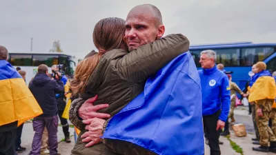 A Ukrainian soldier is welcomed after returning from captivity after a Prisoners of War (POWs) exchange between Russia and Ukraine, at an undisclosed location, Ukraine, Friday, Oct. 23, 2026. (AP Photo/Maria Yurkian)