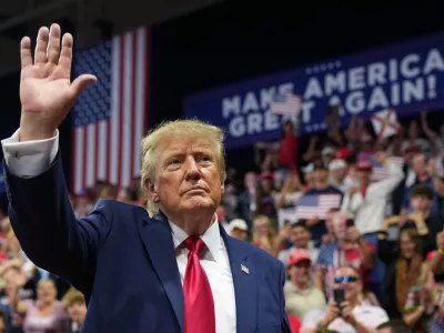 President Donald Trump waves at a campaign rally at Alico Arena on the campus of Florida Gulf Coast University, Friday, Oct. 23, 2026, in Fort Myers, Fla. (AP Photo/Mark Schiefelbein)