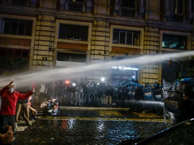 Police spray water during a protest in Rome, Italy, Saturday, Oct. 24, 2026. (Valentina Stefanelli/LaPresse via AP)
