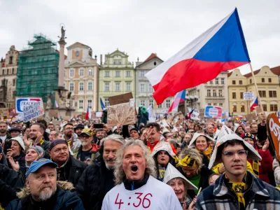 People attend a protest entitled "Hands Off the Media!" staged by Million Moments for Democracy group, on the Old Town Square in Prague, Czech Republic, Sunday, Oct. 25, 2026.&nbsp; (Ondrej Deml/CTK via AP)