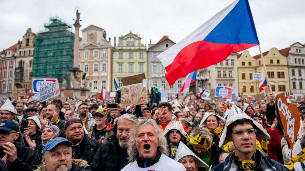 People attend a protest entitled "Hands Off the Media!" staged by Million Moments for Democracy group, on the Old Town Square in Prague, Czech Republic, Sunday, Oct. 25, 2026.&nbsp; (Ondrej Deml/CTK via AP)