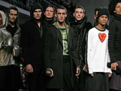 Hooded coats, jerseys and leathers in the Jean Paul Gaultier boxing finale at the Men's Fall Winter 2010-2011 fashion collection in Paris, Thursday Jan. 21, 2010. The fall men's season began here seriously, almost reluctantly, with its nose in a book. That was the sense conveyed in the dark, gold-flecked tweeds at Louis Vuitton, the layers of jackets and vests over untucked white shirts, a style that somehow suggests laundresses and narcissism.,Image: 51584165, License: Rights-managed, Restrictions:, Model Release: no 