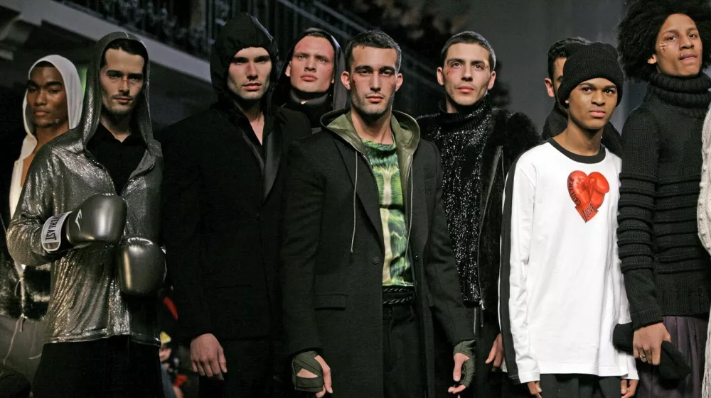 Hooded coats, jerseys and leathers in the Jean Paul Gaultier boxing finale at the Men's Fall Winter 2010-2011 fashion collection in Paris, Thursday Jan. 21, 2010. The fall men's season began here seriously, almost reluctantly, with its nose in a book. That was the sense conveyed in the dark, gold-flecked tweeds at Louis Vuitton, the layers of jackets and vests over untucked white shirts, a style that somehow suggests laundresses and narcissism.,Image: 51584165, License: Rights-managed, Restrictions:, Model Release: no 