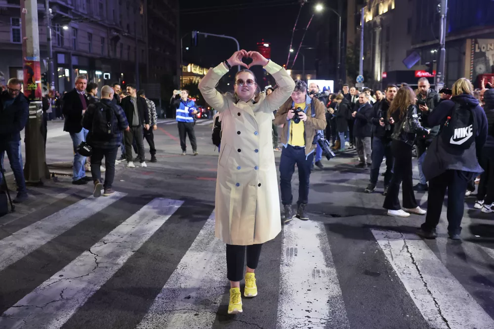 Youngsters celebrate after polls closed in the parliamentary election in Belgrade, Serbia, Sunday, Oct. 25, 2026. (AP Photo/Armin Durgut)