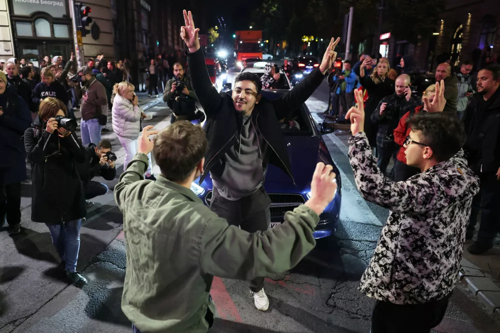 Youngsters celebrate after polls closed in the parliamentary election in Belgrade, Serbia, Sunday, Oct. 25, 2026. (AP Photo/Armin Durgut)
