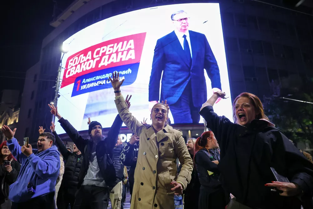 Youngsters cheer after polls closed in the parliamentary election in Belgrade, Serbia, Sunday, Oct. 25, 2026. (AP Photo/Marko Drobnjakovic)