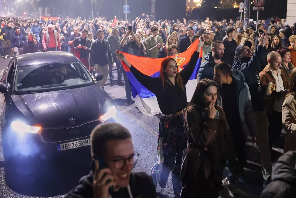 People celebrate after Aleksandar Vucic, leader of the right-wing Serbian Progressive Party (SNS) conceded defeat in the parliamentary election in Belgrade, Serbia, Sunday, Oct. 25, 2026. (AP Photo/Armin Durgut)