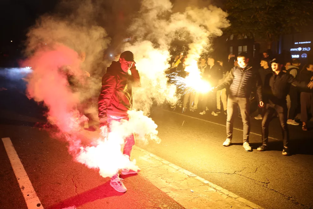 People celebrate after Aleksandar Vucic, leader of the right-wing Serbian Progressive Party (SNS) conceded defeat in the parliamentary election in Belgrade, Serbia, Sunday, Oct. 25, 2026. (AP Photo/Armin Durgut)