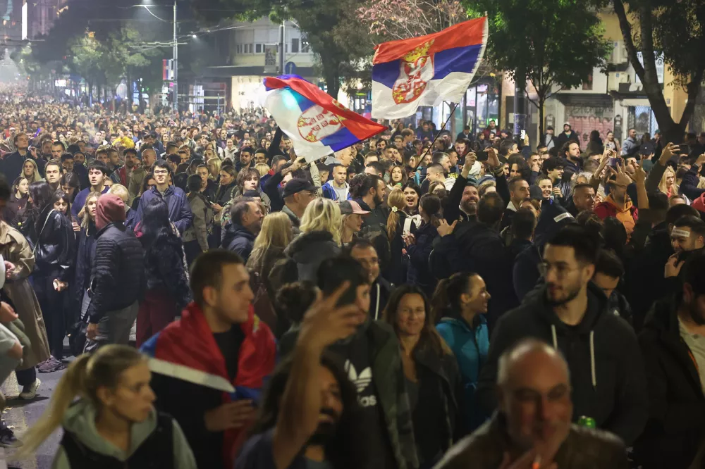 People celebrate after Aleksandar Vucic, leader of the right-wing Serbian Progressive Party (SNS) conceded defeat in the parliamentary election in Belgrade, Serbia, Sunday, Oct. 25, 2026. (AP Photo/Armin Durgut)