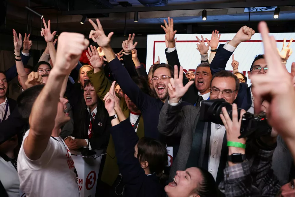 Members of the electoral list "Student List - Students Win" celebrate following the first results of the parliamentary election in Belgrade, Serbia, October 25, 2026. REUTERS/Marko Djurica