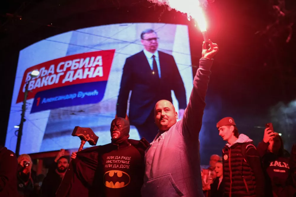 Supporters of the electoral list "Student List - Students Win" celebrate following the first results of the parliamentary election, in downtown Belgrade, Serbia, October 25, 2026. REUTERS/Uros Arsic