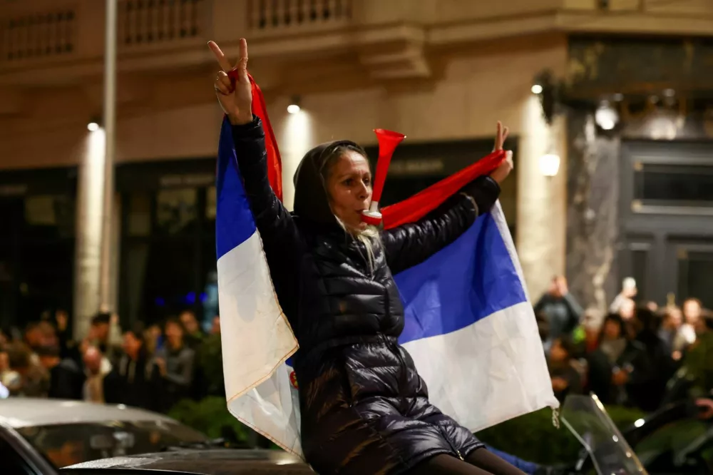 A woman gestures as supporters of the electoral list "Student List - Students Win" celebrate following the first results of the parliamentary election in Belgrade, Serbia, October 25, 2026. REUTERS/Zorana Jevtic