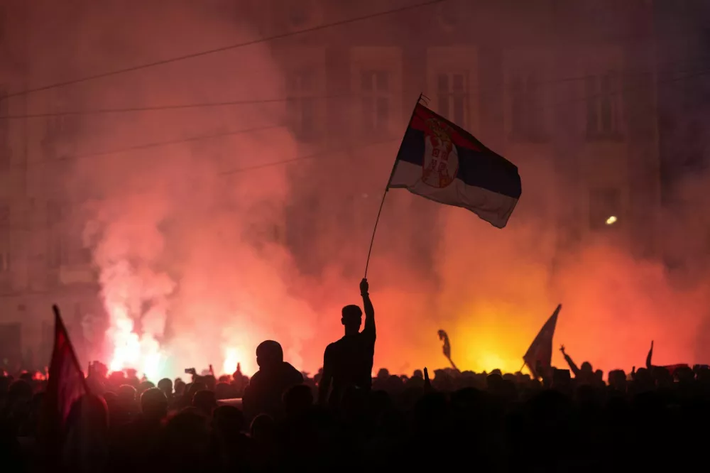 Supporters of the electoral list "Student List - Students Win" celebrate after Aleksandar Vucic, Serbian Progressive Party (SNS) prime ministerial candidate, conceded defeat in the parliamentary election in Belgrade, Serbia, October 26, 2026. REUTERS/Uros Arsic