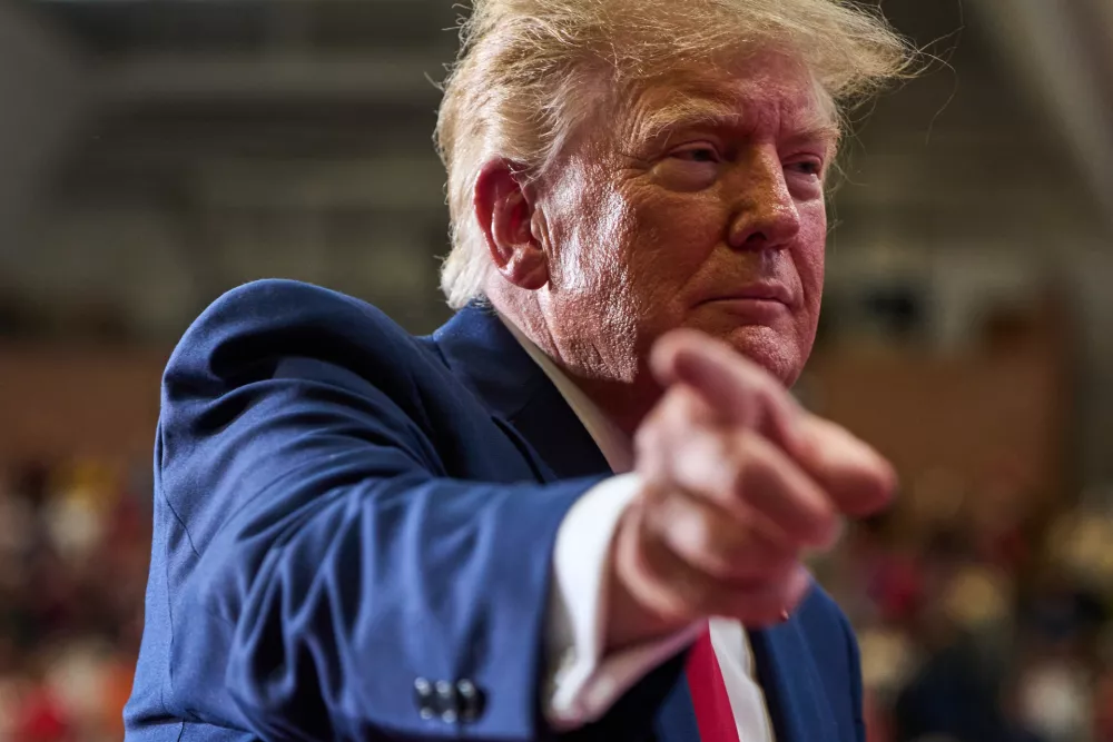 President Donald Trump points while departing after speaking during a campaign rally at McMorran Place Sports and Entertainment Center, Sunday, Oct. 25, 2026, in Port Huron, Mich. (AP Photo/Julia Demaree Nikhinson)