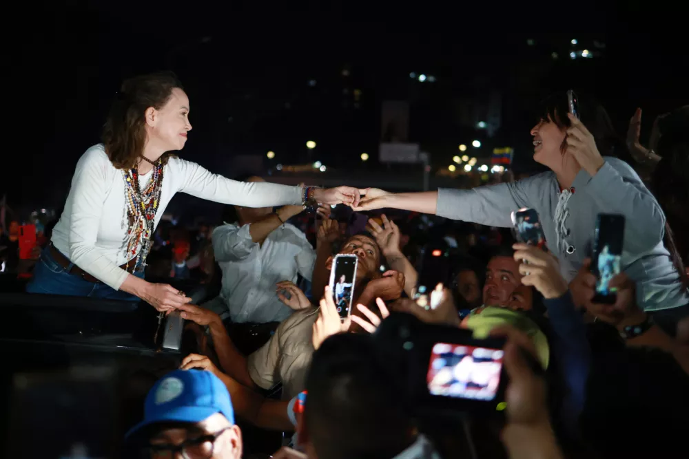 Venezuelan opposition leader and Nobel Peace Prize laureate Maria Corina Machado arrives in Caracas following her return to the country after months abroad, Sunday, Oct. 25, 2026.(AP Photo/Javier Campos)