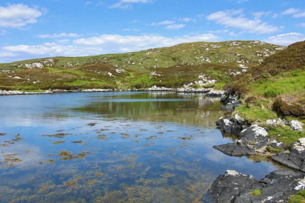 Story from Jam Press (Historic Isle Sale)Pictured: The private and accessible island extending to about 970 acres.Entire historic ISLAND that once sheltered Scotland's Bonnie Prince Charlie after he fled famous battle goes on saleAn entire historic island that once sheltered Scotland's Bonnie Prince Charlie after he fled the Battle of Culloden is up for sale.The Isle of Wiay, just off the east coast of Benbecula in the Outer Hebrides, extends to approximately 970 acres and comes with sandy beaches, freshwater lochs, sheltered anchorages and an abundance of wildlife.Beinn a' Tuath is the island's highest point at 335ft above sea level.The location also has strong Jacobite associations.In 1746, Bonnie Prince Charlie is said to have sought refuge on Wiay while fleeing government forces following his defeat at Culloden, as reported by Luxury Property News.A cave at the foot of Beinn a' Tuath, known locally as Prince Charlie's Rest, is traditionally believed to have sheltered the prince during his escape.Wiay was once home to a small crofting community and traces of its past remain, including the ruins of a cottage overlooking Bagh na Murla, a sheltered bay on the western shore.Planning consent was previously granted to renovate the cottage, although it has now lapsed.The island has no services.Its freshwater lochs offer fishing opportunities, while sporting rights are included in the sale and stalking is among the island's sporting pursuits.The remote landscape has recorded nesting sites for both golden eagles and white-tailed sea eagles.Wiay has also supported around 200 sheep in the past, with good grazing on its lower slopes.Sheltered by Benbecula to the west, the island boasts far-reaching views across the surrounding waters, with the Cuillin mountains of Skye visible on the eastern horizon on clear days.Estate agent Carl Warden said: "The opportunity to own an entire Hebridean island with an asking price below Ł1 million is certain to capture people's imagination."Add in Wiay's traditional connection to Bonnie Prince Charlie, its sandy beaches and extraordinary wildlife, and you have a property with a remarkable story to tell."With approximately 970 acres to call your own, it offers privacy and a sense of escape in a spectacular setting."Wiay is part of the Uists, a chain of interconnected islands in the southern Outer Hebrides.Balivanich on Benbecula is the closest settlement and serves as the commercial and administrative hub of the Uists, with shops, supermarkets, healthcare facilities, schools, caf&eacute;s and Benbecula Airport, which provides regular flights to the mainland.The wider Uists are known for their white-sand beaches, machair grasslands, freshwater lochs and abundant wildlife including seals, dolphins and whales, as well as their strong tradition of language and culture.After his crushing defeat at Culloden, Bonnie Prince Charlie went into hiding as government forces hunted him across the Highlands and islands.He eventually escaped to France, helped by Flora MacDonald, who disguised him as her serving woman.The Isle of Wiay is being offered by agents Bell Ingram at offers over Ł995,000.ENDSEDITOR'S NOTE: Non-Exclusive Licence: A non-exclusive licence has been obtained directly from the verified copyright holder. The copyright holder retains the ability to license the content elsewhere.,Image: 1141365266, License: Rights-managed, Restrictions: EDITOR'S NOTE: Non-Exclusive Licence: A non-exclusive licence has been obtained directly from the verified copyright holder. The copyright holder retains the ability to license the content elsewhere., Model Release: no 