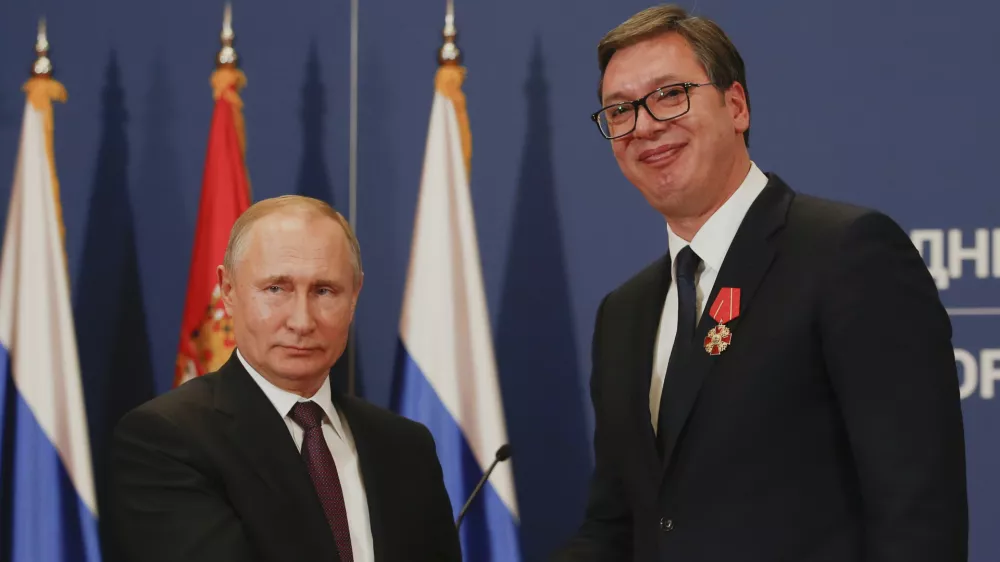 FILE - Russian President Vladimir Putin, left, shakes hands with Serbian President Aleksandar Vucic after being awarded the Order of Alexander Nevsky in Belgrade, Serbia, Thursday, Jan. 17, 2019. (AP Photo/Darko Vojinovic, File)