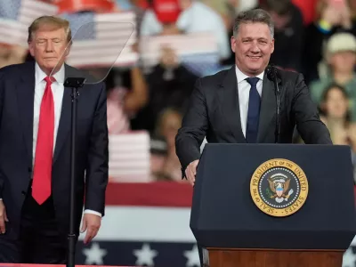 President Donald Trump listens as. Gernot D&ouml;llner, CEO of Audi AG, speaks at a campaign rally at Guardian Centers of Georgia, Saturday, Oct. 24, 2026, in Perry, Ga. (A5P Photo/Mike Stewart)