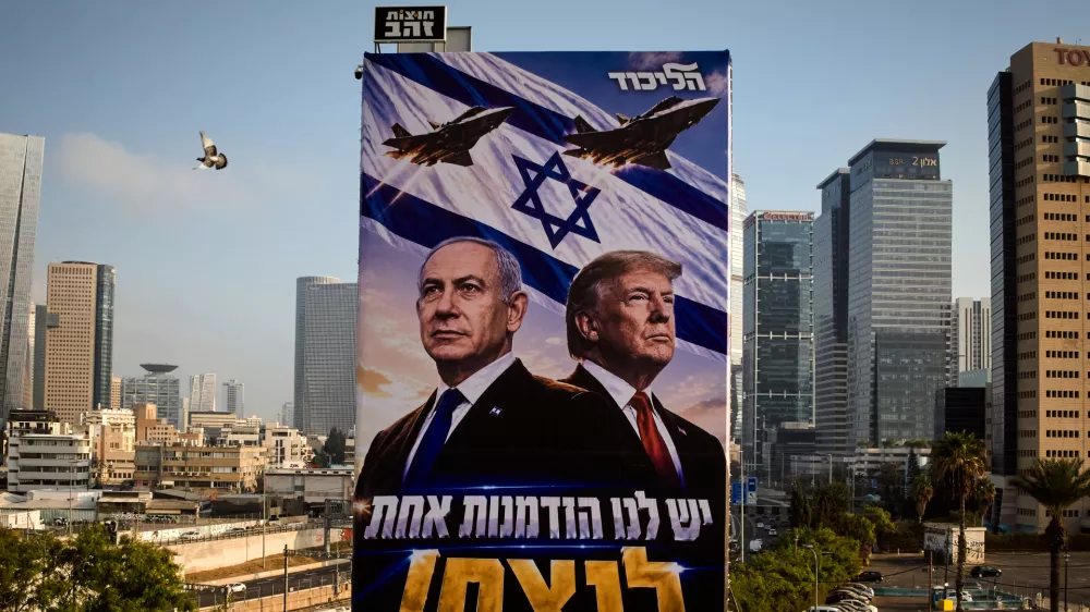A pigeon flies past a Likud Party campaign billboard featuring U.S. President Donald Trump and Israeli Prime Minister Benjamin Netanyahu, with a Hebrew message reading, "We have one opportunity to win," in Tel Aviv, Israel, Monday, Oct. 26, 2026. (AP Photo/Oded Balilty)