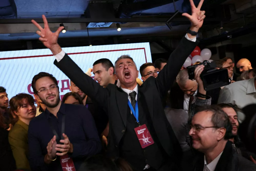 Ilija Srdanovic, first on the electoral list "Student List - Students Win", celebrates following the first results of the parliamentary election in Belgrade, Serbia, October 25, 2026. REUTERS/Marko Djurica     TPX IMAGES OF THE DAY