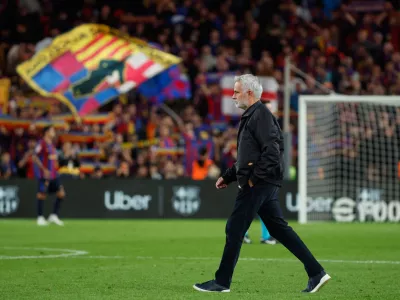 Real Madrid's head coach Jose Mourinho leaves the field at the end of the Spanish La Liga soccer match between FC Barcelona and Real Madrid in Barcelona, Spain, Sunday, Oct. 25, 2026. (AP Photo/Joan Monfort)
