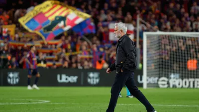 Real Madrid's head coach Jose Mourinho leaves the field at the end of the Spanish La Liga soccer match between FC Barcelona and Real Madrid in Barcelona, Spain, Sunday, Oct. 25, 2026. (AP Photo/Joan Monfort)