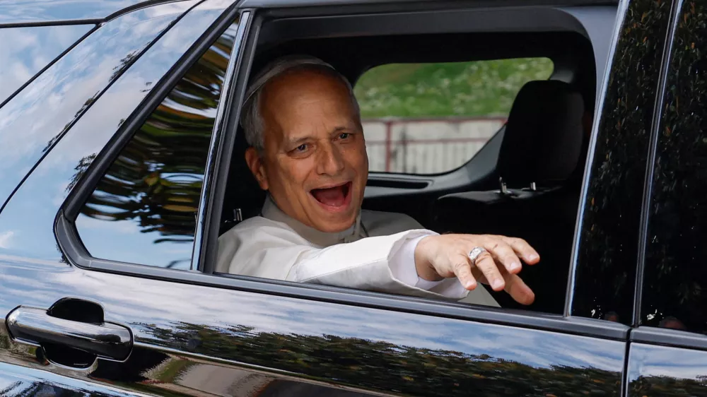 FILE PHOTO: Pope Leo reacts while sitting in a car as he leaves Gemelli Hospital following his lung surgery and cancer diagnosis, in Rome, Italy, October 17, 2026. REUTERS/Remo Casilli/File Photo
