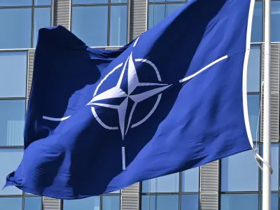 FILED - 03 April 2025, Belgium, Brussels: A NATO flag flies in the wind in front of the NATO headquarters in Brussels. Photo: Anna Ross/dpa