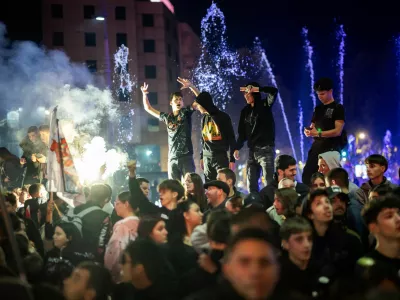 People celebrate the victory of the Student List at parliamentary election after Aleksandar Vucic conceded defeat, at Slavija Square in Belgrade, Serbia, October 26, 2026. REUTERS/Marko Djurica