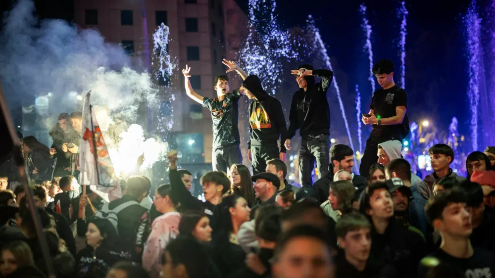 People celebrate the victory of the Student List at parliamentary election after Aleksandar Vucic conceded defeat, at Slavija Square in Belgrade, Serbia, October 26, 2026. REUTERS/Marko Djurica
