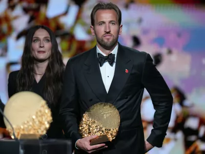 England's soccer player Harry Kane wins the trophy for striker of the year during the Ballon d'Or ceremony at the London Palladium Theatre in London, England, Monday, Oct. 26, 2026. (AP Photo/Kin Cheung)