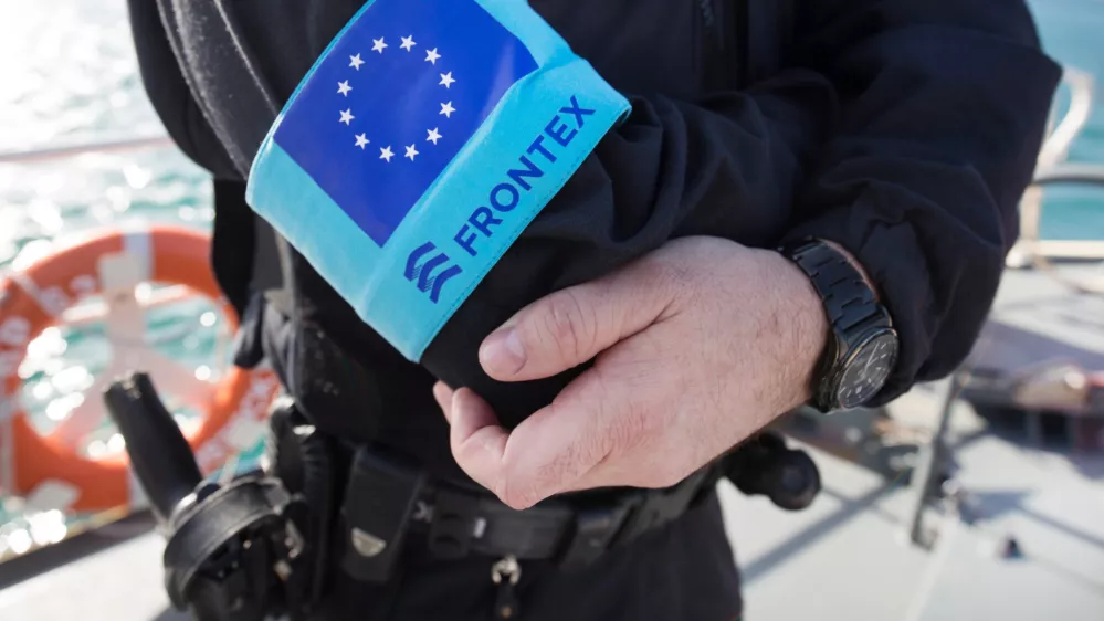 FILED - 01 March 2016, Greece, Vathi: A police officer of the EU border protection agency Frontex stands on the foredeck of a patrol boat in the port of the island of Samos. The&nbsp;European Union's second-highest court has dismissed a case brought by a Syrian family asking for damages against the bloc's border agency Frontex over alleged human rights abuses. Photo: Christian Charisius/dpa