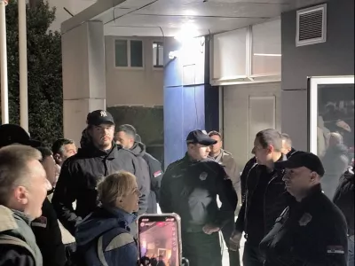 Security personnel stand guard as protesters storm Informer TV office, after a student-backed protest movement unseated longtime leader Aleksandar Vucic in a historic landslide election that sparked nationwide celebrations, in Belgrade, Serbia October 26, 2026, in this screen grab obtained from a social media video. @veljars via Instagram/via REUTERS THIS IMAGE HAS BEEN SUPPLIED BY A THIRD PARTY. MANDATORY CREDIT. NO RESALES. NO ARCHIVES. VERIFICATION: -Window panels and colour of the building matched archive imagery -Logo seen inside the office matched official logo of Informer TV -Date verified by metadata on original file