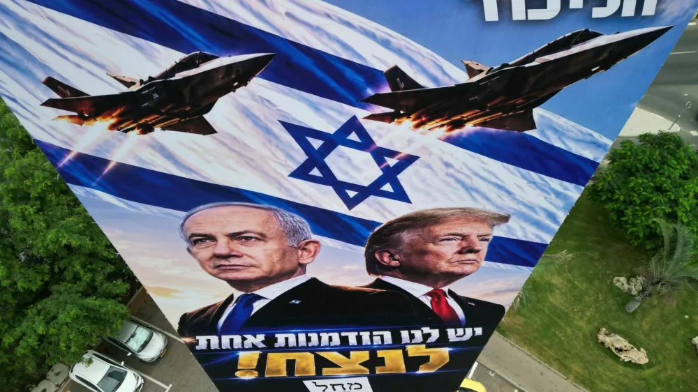 A drone view of an election campaign display for Israeli Prime Minister Benjamin Netanyahu's Likud party, depicting Netanyahu and US President Donald Trump with the words in Hebrew "we have one opportunity to win!", the day before Israel's national election, in Tel Aviv, Israel, October 26, 2026. REUTERS/Amir Cohen