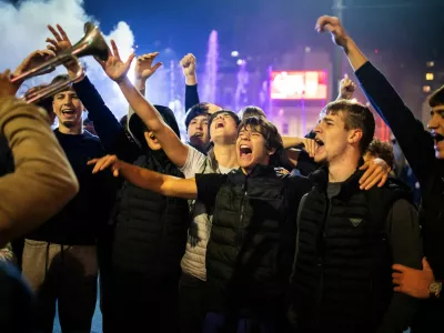 People celebrate the victory of the Student List at parliamentary election after Aleksandar Vucic conceded defeat, at Slavija Square in Belgrade, Serbia, October 26, 2026. REUTERS/Marko Djurica