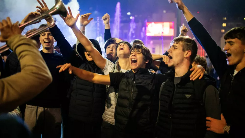 People celebrate the victory of the Student List at parliamentary election after Aleksandar Vucic conceded defeat, at Slavija Square in Belgrade, Serbia, October 26, 2026. REUTERS/Marko Djurica