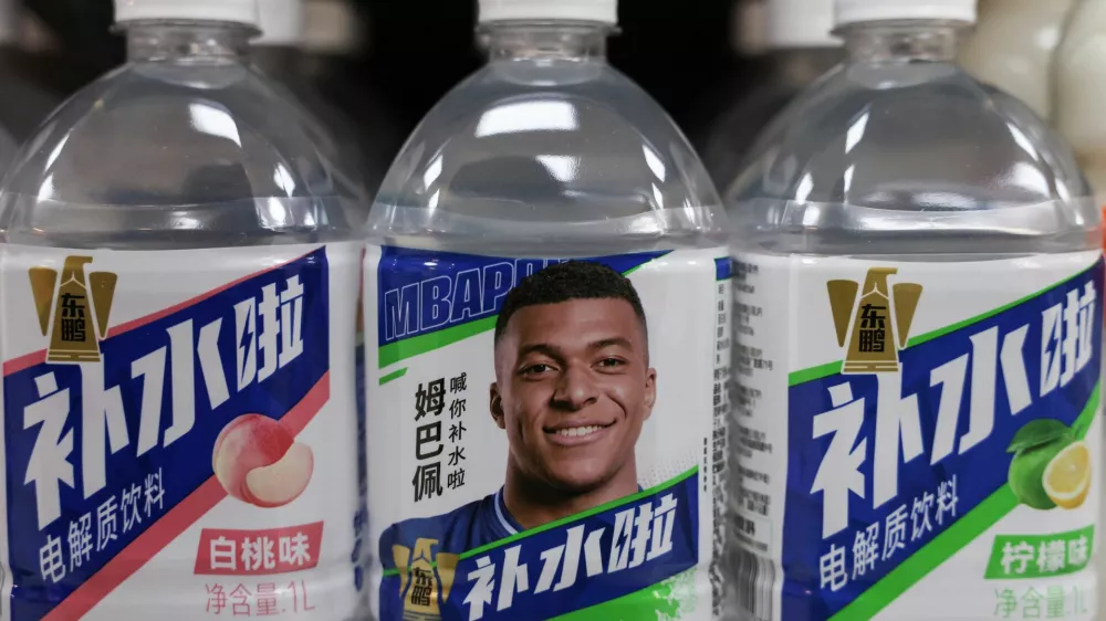 Bottled drinks by Eastroc Beverage with images of French soccer player Kylian Mbappe are displayed on a shelf at a store, in Beijing, China October 27, 2026. REUTERS/Tingshu Wang