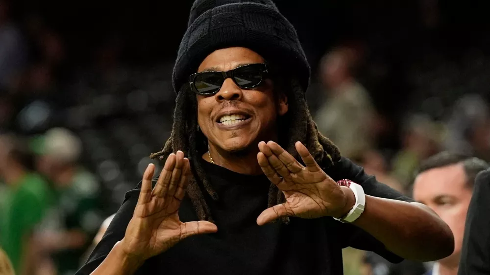 FILE - Jay-Z gestures from the sidelines prior to the NFL Super Bowl 59 football game, Feb. 9, 2025, in New Orleans. (AP Photo/Frank Franklin II, File)