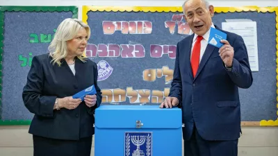 Israel's Prime Minister Benjamin Netanyahu and his wife Sara prepare to vote at a polling station in Jerusalem on October 27, 2026, on the day of Israel's legislative election. Yonatan Sindel/Pool via REUTERS   TPX IMAGES OF THE DAY