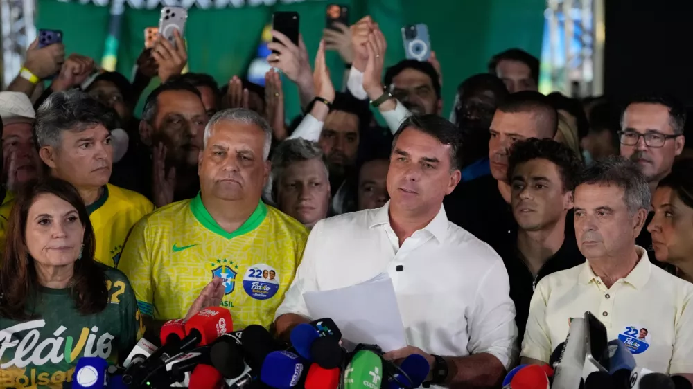 FILE - Opposition presidential candidate Sen. Flavio Bolsonaro speaks after the presidential election runoff in Brasilia, Brazil, Oct. 25, 2026. (AP Photo/Eraldo Peres, File)