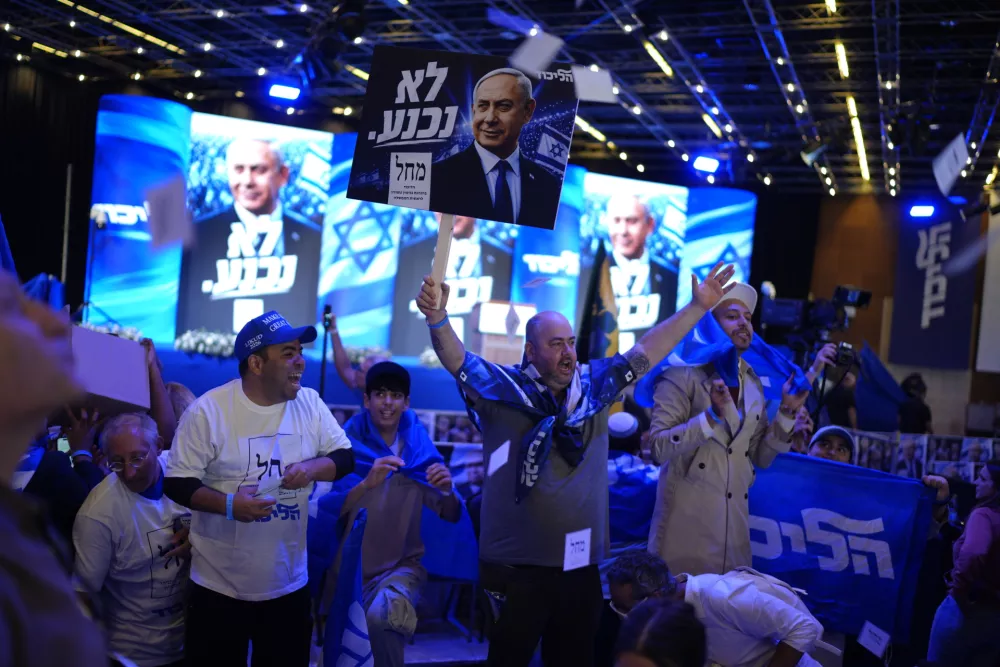 Supporters of Israeli Prime Minister Benjamin Netanyahu celebrate at Likud party headquarters in Jerusalem following the release of the first exit poll results in Israel's general election Wednesday, Oct. 28, 2026. (AP Photo/David Goldman)